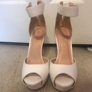 White platform pumps